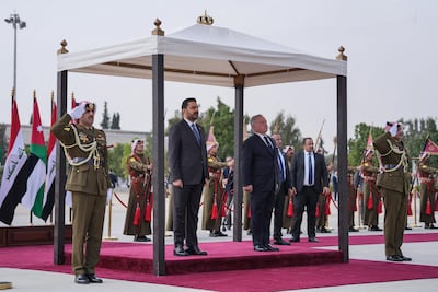 Iraqi Prime Minister Ali Al Zaidi with Jordan's King Abdullah II during a welcome ceremony in Amman, on October 26. AFP