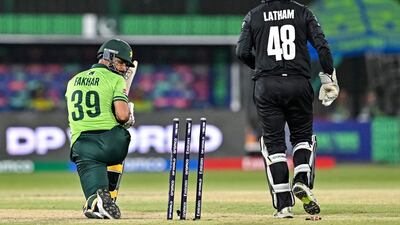 Pakistan's injured batsman Fakhar Zaman looks at the stumps after being clean bowled during the Champions Trophy match against New Zealand at the National Stadium in Karachi on Wednesday, February 19, 2025. AFP