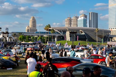 Bidders and car enthusiasts gather at RM Sotheby’s auction at Emirates Golf Club in Dubai. Photo by Ahmed Ramzan for The National