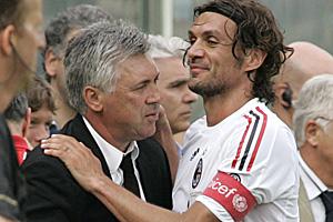 The departing AC Milan coach Carlo Ancelotti, left, is embraced by outgoing captain Paolo Maldini after their final match of the season against Fiorentina in Florence. It was the last game at the club for both of them.