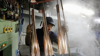 The torches for the 2020 Tokyo Olympics are manufactured at a factory in Tokyo. Kyodo / Reuters