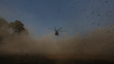 A helicopter carrying bodies of plane crash victims arrives in Kathmandu, Nepal. AP Photo