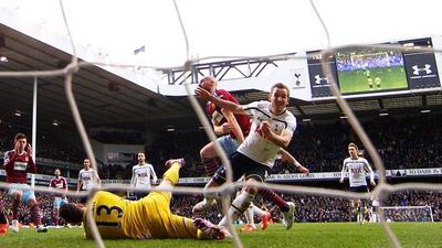 Harry Kane slots home the rebound fro, his saved penalty to hand Tottenham a draw with the last kick of the game. Paul Gilham / Getty