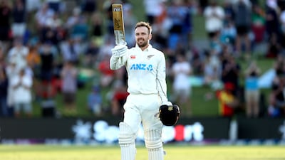 Tom Blundell raises his bat after reaching his century on day two of the Test match between New Zealand and England at the Bay Oval. Getty