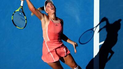 Caroline Wozniacki of Denmark serves in her first-round match against Yulia Putintseva of Kazakhstan at the 2016 Australian Open at Melbourne Park. Mark Kolbe / Getty Images