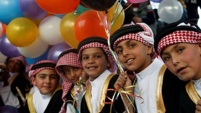 Children dressed in Jordanian traditional costumes celebrate the one millionth visitor for 2019 in the ancient city of Petra. Reuters