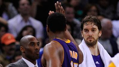 Kobe Bryant, left, was missing from the game against Golden State Warriors but Los Angeles Lakers still won comfortably.