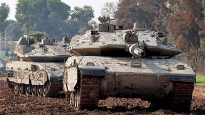 Israeli tanks on the border of southern Israel and the Gaza Strip on January 2, 2024. The Israeli military says reservists are returning to civilian life as the financial burden of war against Gaza is felt AFP