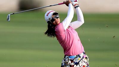 Pornanong Phatlum of Thailand plays a shot during the third round of the 2013 Omega Dubai Ladies Masters at the Emirates Golf Club in Dubai. Satish Kumar / The National