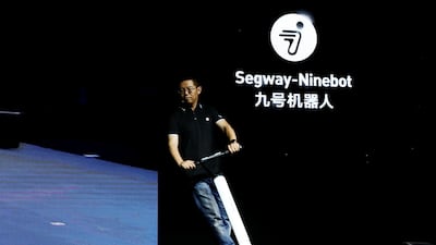 Ninebot president Wang Ye unveils KickScooter T60 that can return itself to charging stations without a driver. Reuters