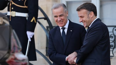 Mr Macron with Canada's Prime Minister Mark Carney. Reuters