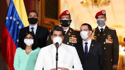 epa08333222 A handout photo made available by Miraflores Presidential Palace shows Venezuelan President Nicolas Maduro (C, bottom) wearing a mask while he makes a statement accompanied by Venezuelan Vice President Delcy Rodriguez (L) and Venezuelan Minister of Foreign Affairs Jorge Arreaza (2-R) at Miraflores Palace in Caracas, Venezuela, 30 March 2020. EPA/MIRAFLORES PRESIDENTIAL PALACE HANDOUT HANDOUT EDITORIAL USE ONLY/NO SALES