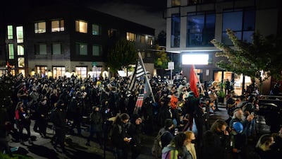 Black Lives Matter protesters march through the streets of Southeast Portland, Oregon. President Donald Trump and Democratic challenger Joe Biden are battling it out for the White House, with polls closed across the United States Tuesday -- and a long night of waiting for results in key battlegrounds on the cards. AFP