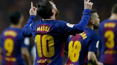 Lionel Messi celebrates after scoring Barcelona's second goal against Sevilla during their Copa del Rey final at the Wanda Metropolitano stadium in Madrid. Francisco Seco / AP Photo