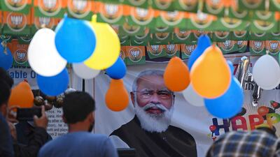 Bharatiya Janata Party workers gather to celebrate the 71st birthday of India's Prime Minister Narendra Modi at party headquarters in Srinagar. AFP