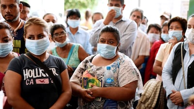 Relatives of missing persons are seen outside the morgue after attending a viewing of photographs of clothing, accessories and identification cards found on bodies recovered recently from mass graves. Reuters