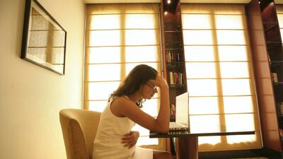 INDIA - OCTOBER 10: Pregnant woman facing work stress, headache at her Residence in New Delhi, India ( Model, Sex ) (Photo by Bandeep Singh/The India Today Group/Getty Images)