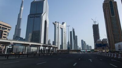 The deserted streets of Dubai with the Burj Khalifa in the background during April. EPA