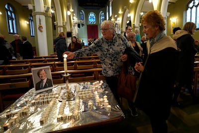 Mourners light candles at St Michaels Church in Leigh-on-Sea. close to where Sir David Amess was stabbed to death while holding a constituency surgery. AP Photo