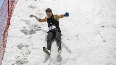 Participants slid down the snow-covered slope.
