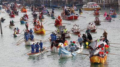 Venetians row during the masquerade parade on the Grand Canal during the carnival in Venice. Tony Gentile / Reuters