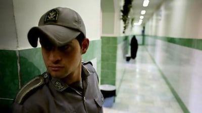 A guard stands along a corridor in Tehran's Evin prison. Reuters