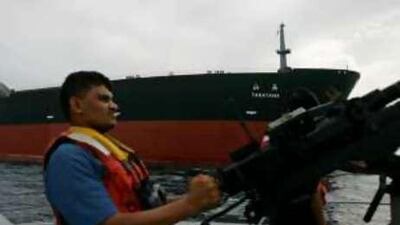 The Yemeni coastguard patrols near the Japanese oil tanker Takayama as it sails outside Aden.