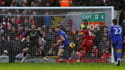 Liverpool's Harvey Elliott fires home their third goal. PA