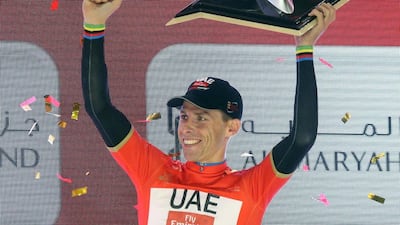 Portuguese rider Rui Costa of UAE Team Emirates celebrates on the podium after winning the Abu Dhabi Tour cycling red jersey. Matteo Bazzi / EPA