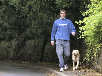 Roy Keane, former captain of Ireland's World Cup team, arrives back at his Cheshire home after taking his dog for a walk on May 28, 2002. Reuters
