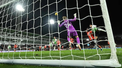 Luis Diaz leaps to head the equaliser. AFP