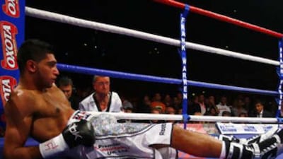 Amir Khan after being knocked out in the first round by Colombian opponent Breidis Prescott at the MEN Arena, Manchester, England.