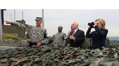 Hillary Clinton, the US secretary of state, and Robert Gates, the defence secretary, at an observation post yesterday for the demilitarised zone between North and South Korea.