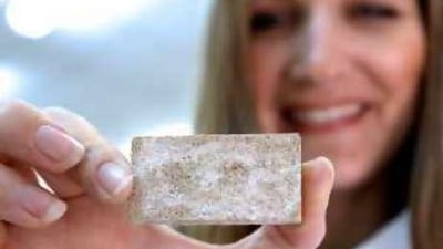 Prof Ginger Dosier shows a brick made of sand, bacteria and urea in her laboratory at American University of Sharjah.