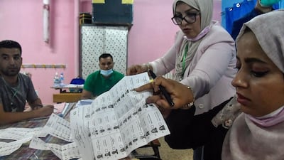 Algerian elections staff count ballots for parliamentary elections at a polling station in Bouchaoui, on the western outskirts of the capital Algiers. AFP