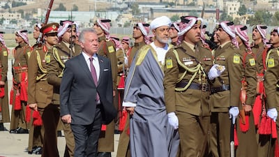 Jordan's King Abdullah reviews an honour guard with Sultan Haitham of Oman on his arrival at Marka Airport in Amman. Reuters