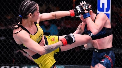 Polyana Viana, left, of Brazil kicks Mallory Martin in their strawweight fight during the UFC 258 event at UFC APEX in Las Vegas, Nevada. Jeff Bottari / Zuffa LLC / UFC