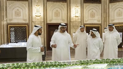 Sheikh Mohammed bin Zayed reviews a model of the Al Maqta Canal Walk project with Musabah Al Marar General Manager of the Abu Dhabi Municipality and Saeed Eid Al Ghafli Chairman of the Department of Municipal Affairs and Abu Dhabi Executive Council member, prior to an Executive Council meeting. Rashed Al Mansoori / Crown Prince Court - Abu Dhabi