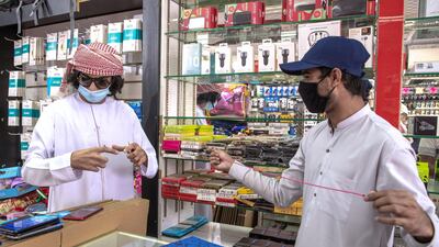 A mobile phone shop customer at Mussafah 32 area. Victor Besa / The National