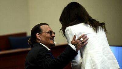 Depp speaks to Ms Vasquez. EPA