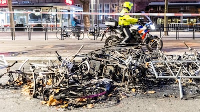 Burnt bikes after a protest against the partial lockdown and against the 2G government policy in Rotterdam. AFP