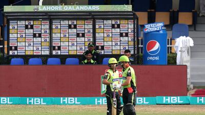 Lahore's AB de Villiers, right, chats with Salman Butt.