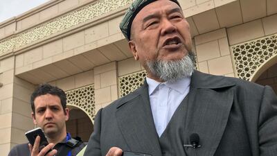 Abudulrekep Tumniaz, dean of Xinjiang Islamic Institute, addresses journalists outside the centre’s new campus in Urumqi, Xinjiang.