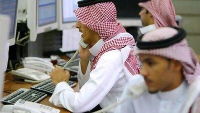 Saudi Arabia's stocks lose around (US$7.5 billion) yesterday as the kingdom's bourse reacts to the US losing its top-tier credit rating from Standard & Poor's. AFP PHOTO/PATRICK BAZ