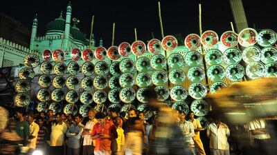 People stand during a loudspeaker competition ahead of the Hindu Dussehra festival in Allahabad . Sanjay Kanojia / AFP
