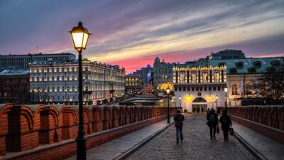 Pedestrians exiting the Kremlin during sunset in Moscow. EPA
