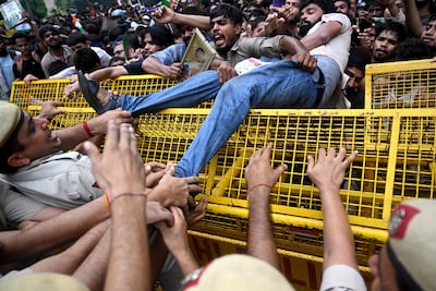 Activists and supporters of the Cockroach Janta Party (CJP) clash with police personnel during a protest demanding the resignation of India's Education Minister Dharmendra Pradhan over alleged NEET examination irregularities in New Delhi. AFP