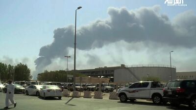 Smoke from a fire at the Abqaiq oil processing facility fills the skyline, in Buqyaq, Saudi Arabia. Al-Arabiya via AP