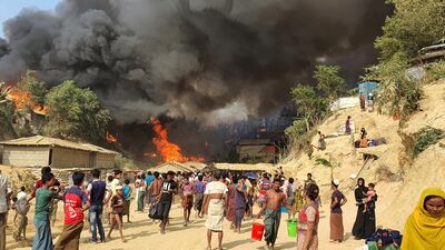 Smoke rises following a fire at the Rohingya refugee camp in Balukhali, southern Bangladesh. AP Photo