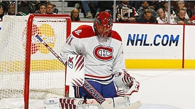 Jaroslav Halak made more than 40 saves as the Montreal Canadiens beat Ottawa to move joint top of their division.